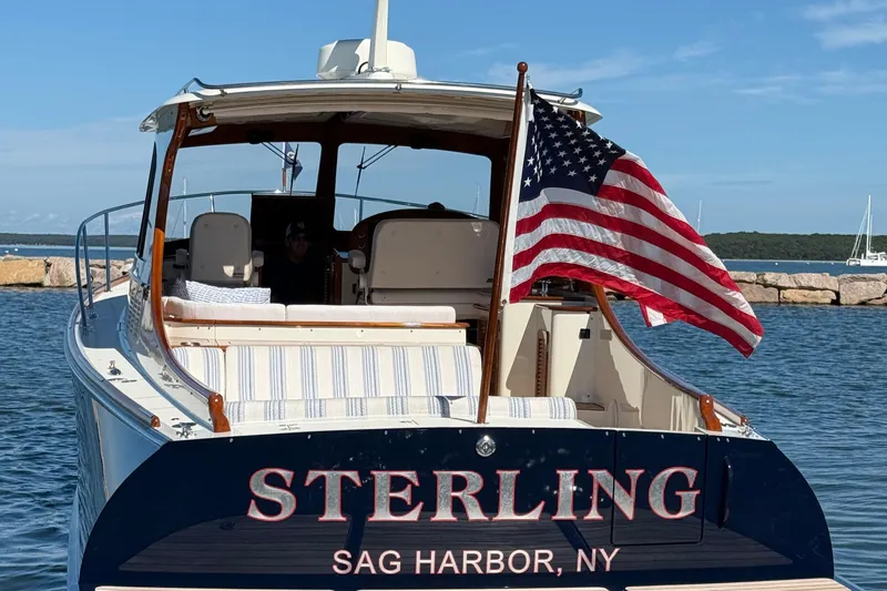 Sterling Yacht Photos Pics 2024 Hinckley Picnic Boat 40 S in Sag Harbor, NY, with American flag.