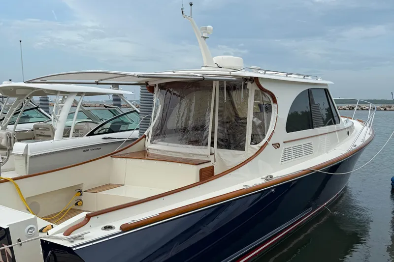 Sterling Yacht Photos Pics 2024 Hinckley Picnic Boat 40 S docked, showcasing elegant design and craftsmanship.