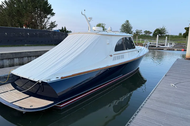 Sterling Yacht Photos Pics 2024 Hinckley Picnic Boat 40 S docked, featuring sleek design and covered deck.