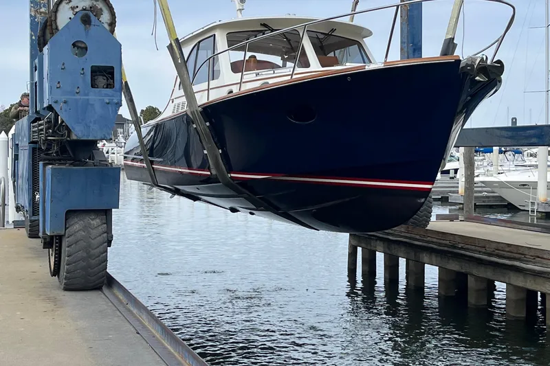 Sterling Yacht Photos Pics 2024 Hinckley Picnic Boat 40 S being lifted at a marina.