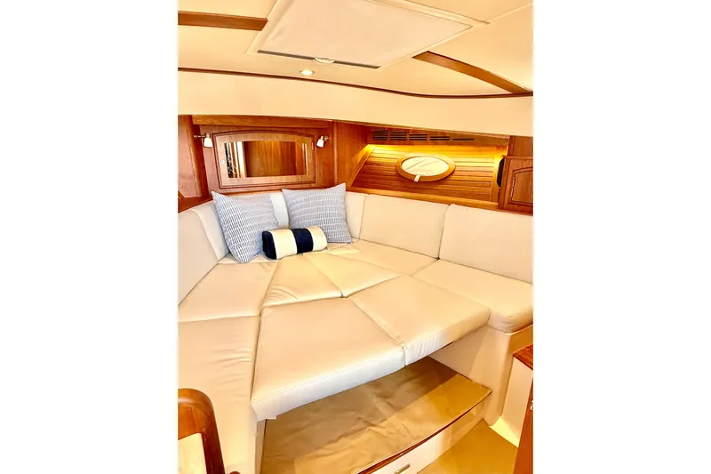Sterling Yacht Photos Pics 2024 Hinckley Picnic Boat 40 S interior with cozy seating and elegant wood accents.