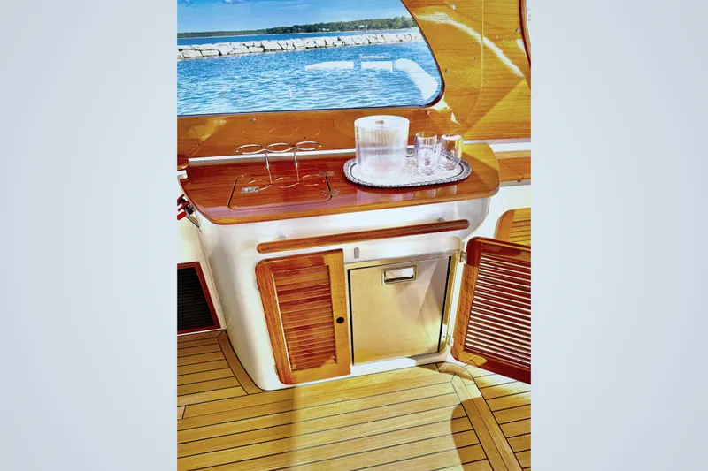 Sterling Yacht Photos Pics 2024 Hinckley Picnic Boat 40 S interior with wooden cabinetry and ocean view.