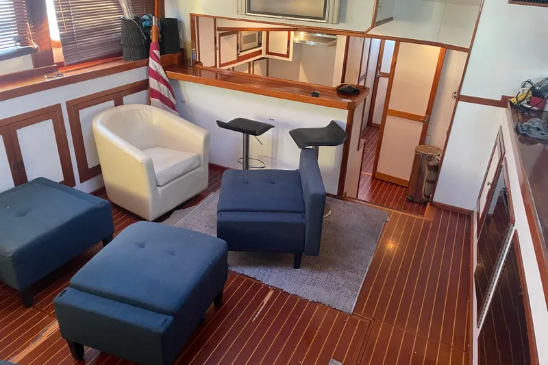  Yacht Photos Pics Interior of 1969 Islander 72 Aft Cabin Motor Yacht with modern seating and wood accents.