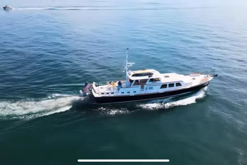  Yacht Photos Pics 1969 Islander 72 Aft Cabin Motor Yacht cruising on open water.