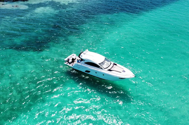 “amor Fati” Yacht Photos Pics 2014 Beneteau Gran Turismo 44 yacht cruising in clear turquoise waters.