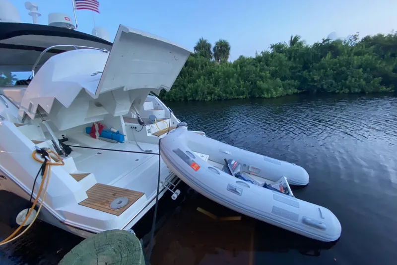 “amor Fati” Yacht Photos Pics 2014 Beneteau Gran Turismo 44 yacht with inflatable boat on calm water.