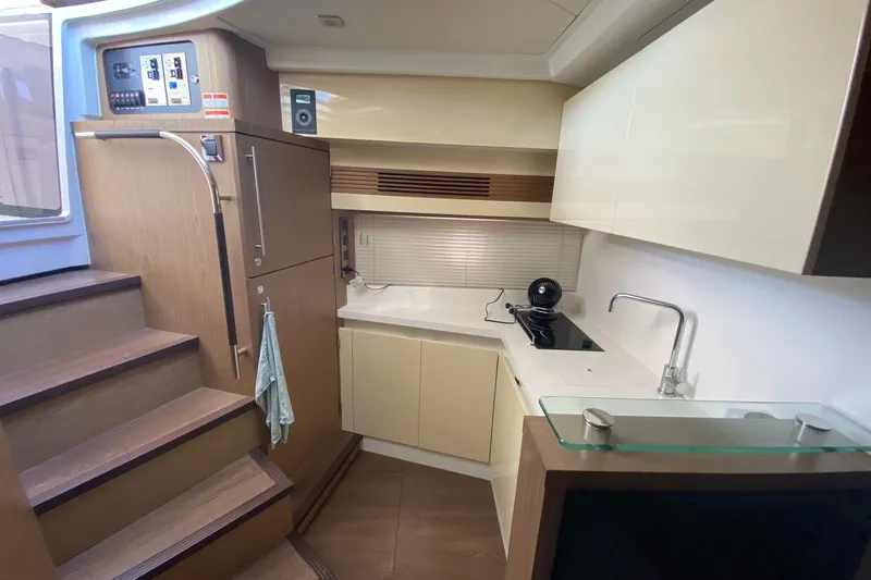 “amor Fati” Yacht Photos Pics 2014 Beneteau Gran Turismo 44 yacht interior kitchen with modern cabinetry and appliances.