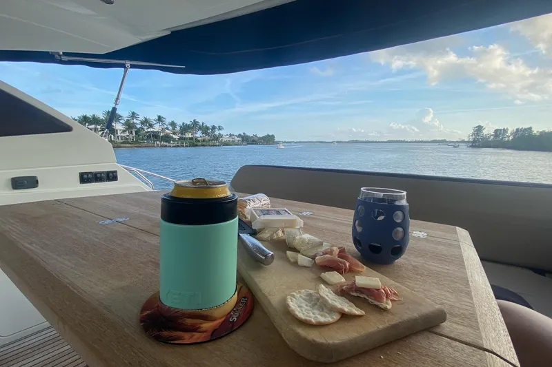 “amor Fati” Yacht Photos Pics Luxurious 2014 Beneteau Gran Turismo 44 yacht with scenic waterfront view and charcuterie board.