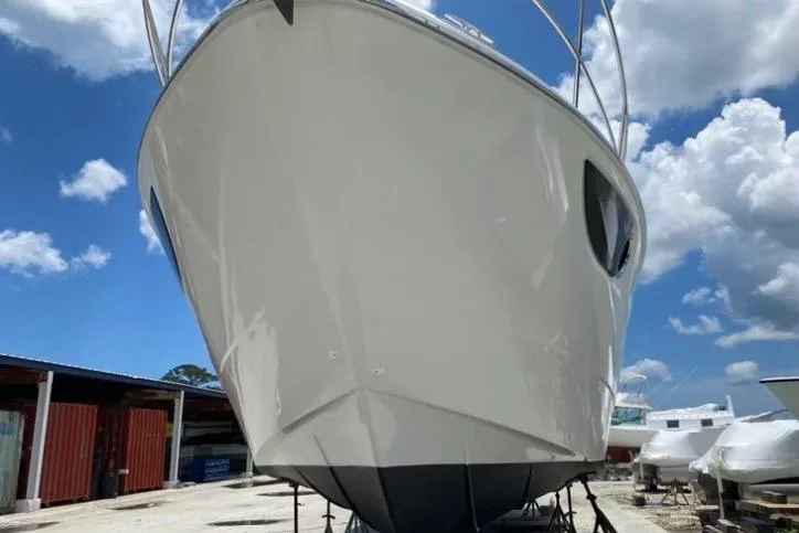 “amor Fati” Yacht Photos Pics 2014 Beneteau Gran Turismo 44 yacht on dry dock under a clear blue sky.