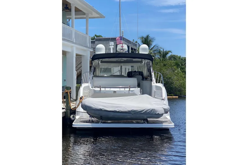 “amor Fati” Yacht Photos Pics 2014 Beneteau Gran Turismo 44 yacht docked, rear view with covered equipment, blue sky background.