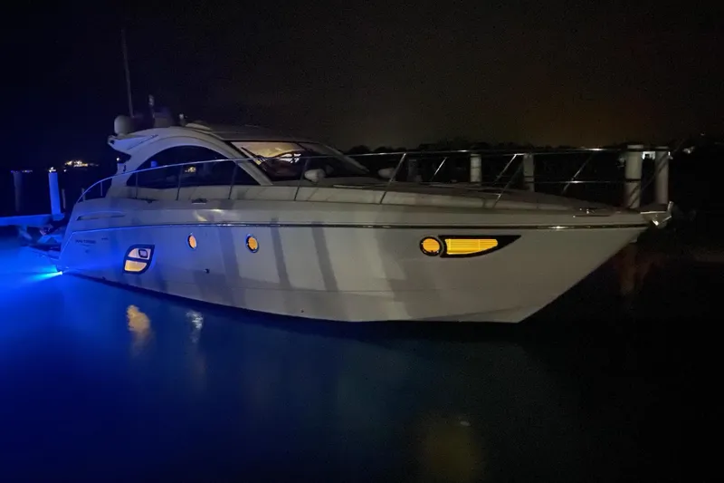 “amor Fati” Yacht Photos Pics 2014 Beneteau Gran Turismo 44 yacht illuminated at night with blue underwater lights.