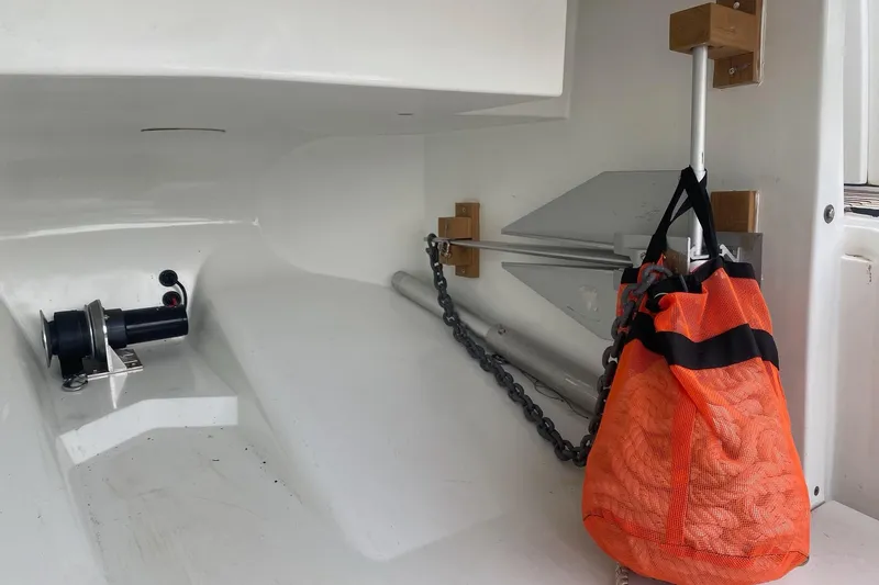“amor Fati” Yacht Photos Pics Storage compartment of 2014 Beneteau Gran Turismo 44 with anchor and orange mesh bag.