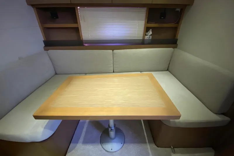“amor Fati” Yacht Photos Pics Cozy seating area with table in 2014 Beneteau Gran Turismo 44 yacht interior.