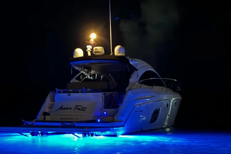 “amor Fati” Yacht Photos Pics 2014 Beneteau Gran Turismo 44 yacht illuminated at night with blue underwater lights.