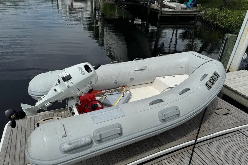 “amor Fati” Yacht Photos Pics Inflatable boat with outboard motor docked beside a Beneteau Gran Turismo 44, 2014 model.
