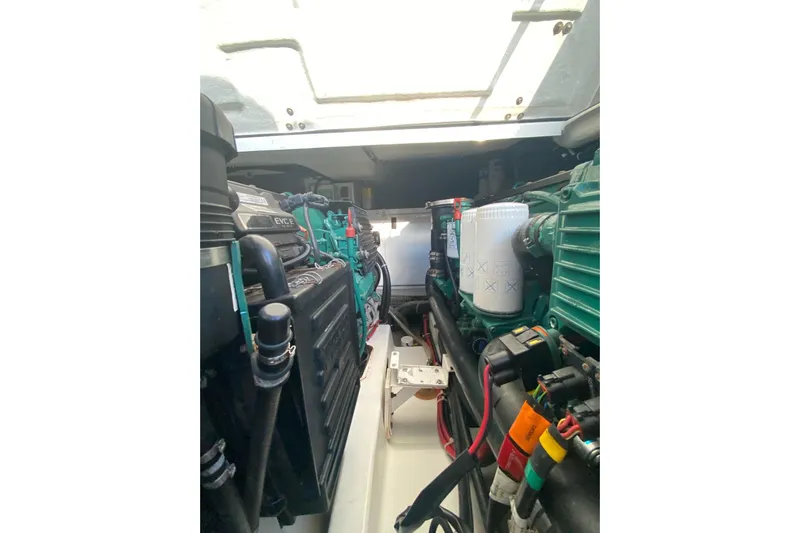 “amor Fati” Yacht Photos Pics Engine compartment of a 2014 Beneteau Gran Turismo 44 yacht, showcasing mechanical components.