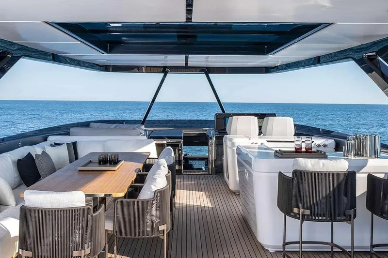  Yacht Photos Pics Luxurious 2026 Ferretti Yachts 940 deck with elegant seating and ocean view.