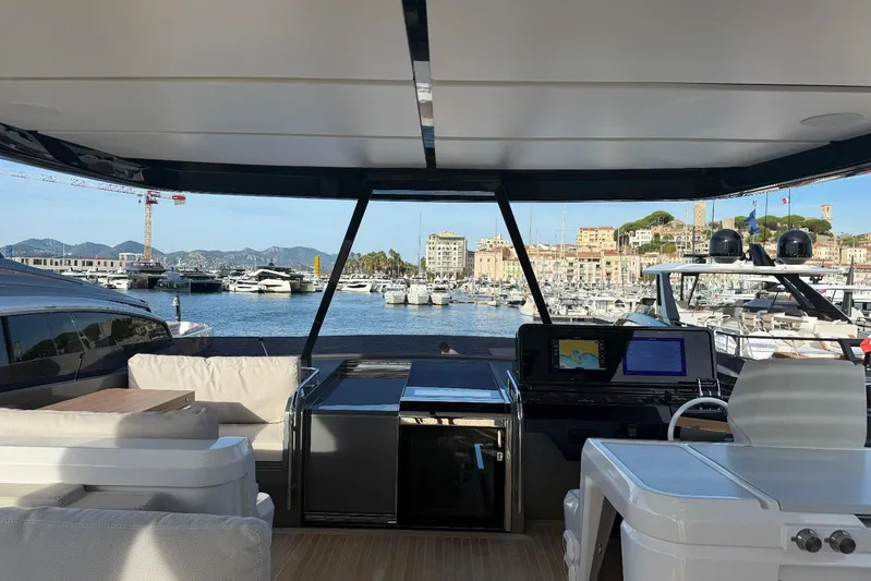  Yacht Photos Pics Luxurious 2026 Ferretti Yachts 940 interior with marina view and modern navigation equipment.