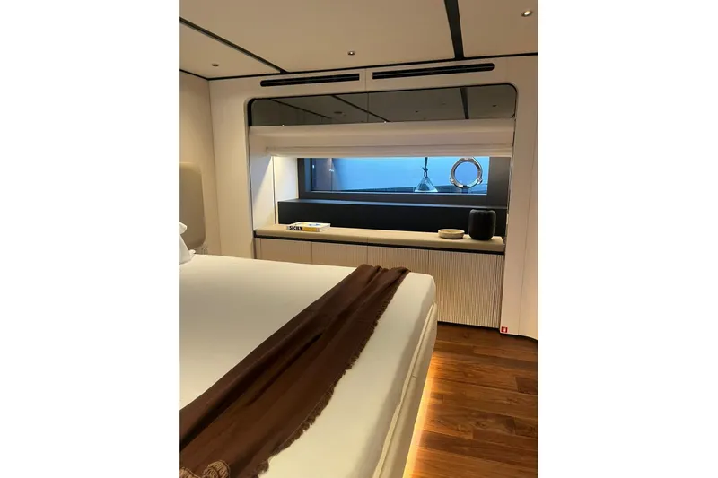  Yacht Photos Pics Luxurious bedroom interior of 2026 Ferretti Yachts 940 with modern design and ocean view.