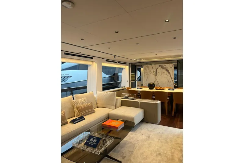  Yacht Photos Pics Luxurious interior of 2026 Ferretti Yachts 940, featuring elegant seating and modern decor.