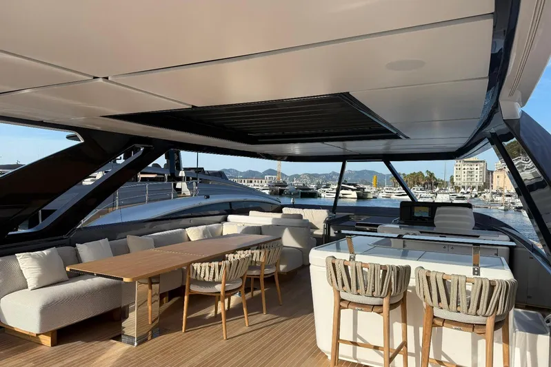  Yacht Photos Pics Luxurious 2026 Ferretti Yachts 940 interior with elegant seating and marina view.