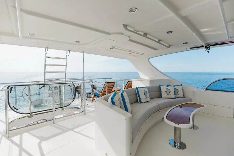 Aurelia Yacht Photos Pics Luxurious 2007 President Tri-Deck yacht interior with ocean view, featuring elegant seating and decor.