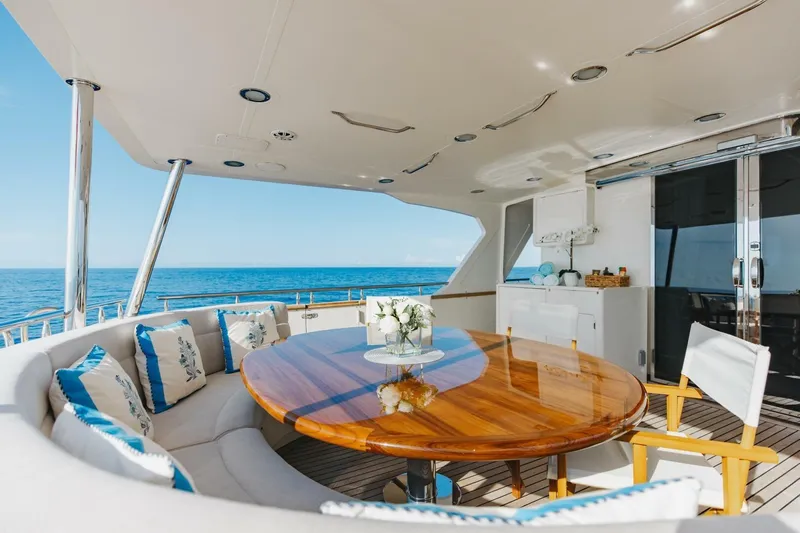 Aurelia Yacht Photos Pics Luxurious 2007 President Tri-Deck yacht deck with elegant seating and ocean view.