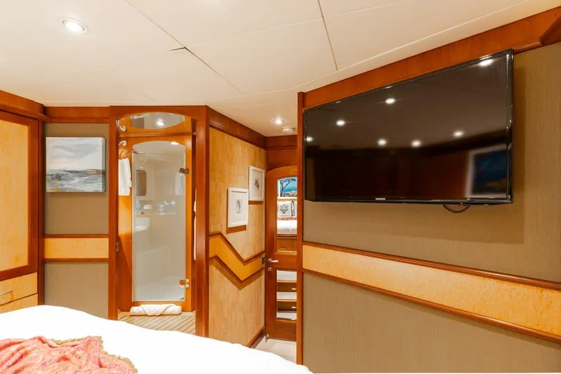 Aurelia Yacht Photos Pics Luxurious 2007 President Tri-Deck yacht interior with TV, artwork, and elegant wood finishes.