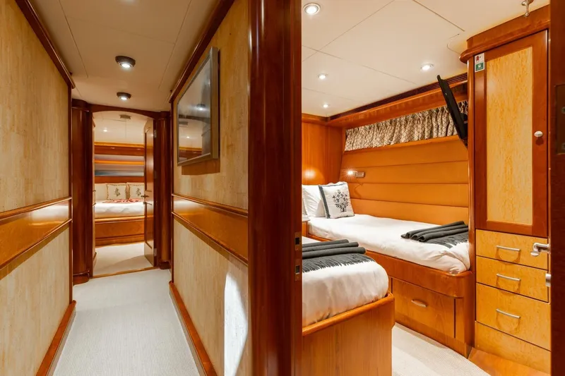 Aurelia Yacht Photos Pics Luxurious interior of 2007 President Tri-Deck yacht with elegant wood finishes and cozy cabin.