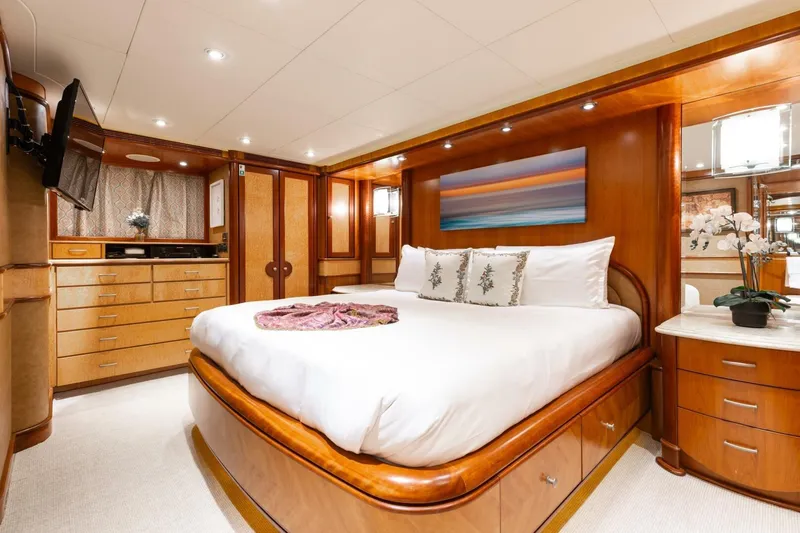 Aurelia Yacht Photos Pics Luxurious 2007 President Tri-Deck yacht bedroom with elegant wood finishes and modern decor.