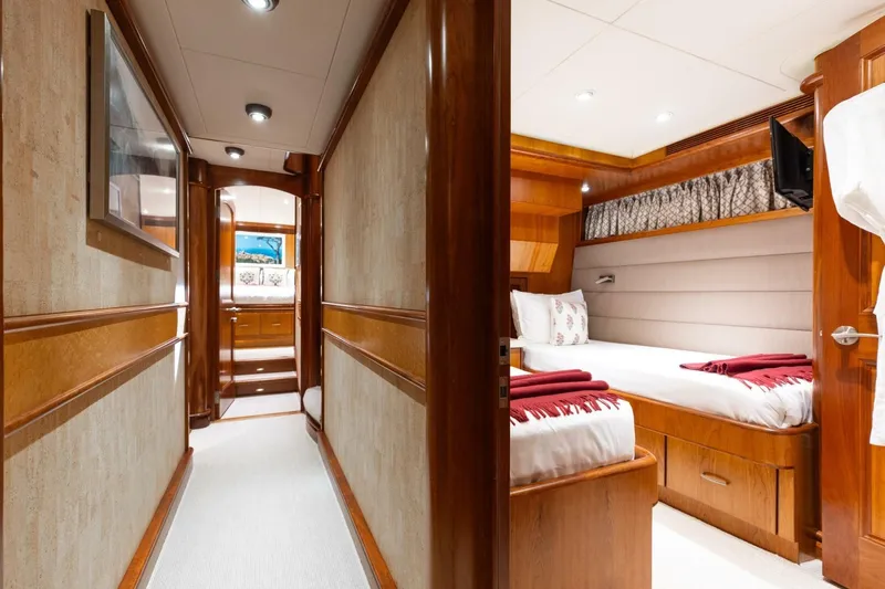 Aurelia Yacht Photos Pics Luxurious 2007 President Tri-Deck yacht interior with elegant wood finishes and cozy bedroom.