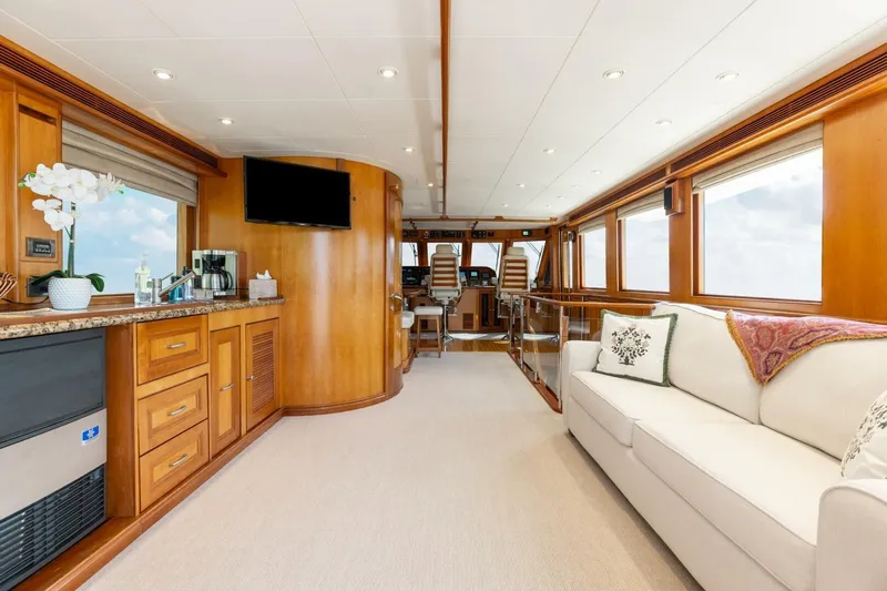 Aurelia Yacht Photos Pics Luxurious interior of 2007 President Tri-Deck yacht with elegant wood finishes and modern amenities.