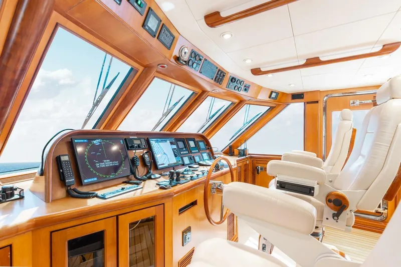 Aurelia Yacht Photos Pics Luxurious 2007 President Tri-Deck yacht helm with advanced navigation equipment and plush seating.