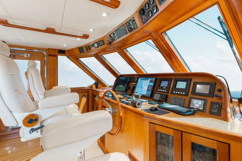 Aurelia Yacht Photos Pics Luxurious 2007 President Tri-Deck yacht helm with advanced navigation systems and plush seating.