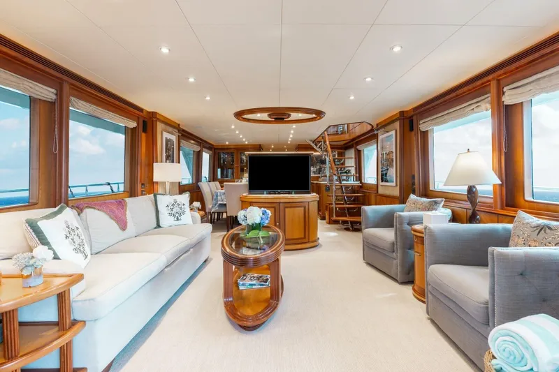 Aurelia Yacht Photos Pics Luxurious interior of 2007 President Tri-Deck yacht with elegant furnishings and panoramic windows.