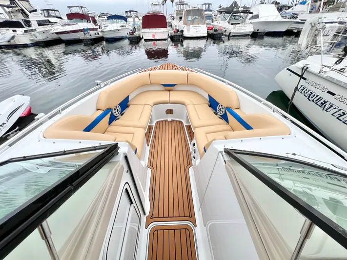  Yacht Photos Pics 2009 Formula 310 BR boat with teak deck and beige seating at marina.