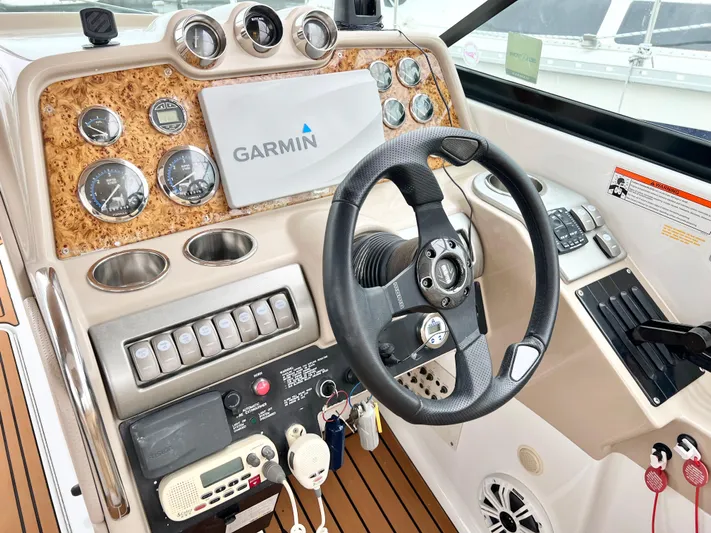  Yacht Photos Pics 2009 Formula 310 BR boat dashboard with Garmin navigation and control instruments.