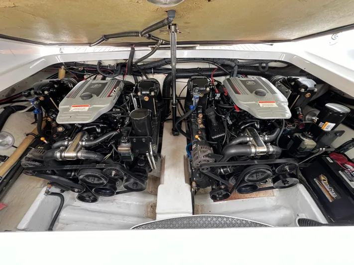 Yacht Photos Pics 2009 Formula 310 BR boat engine compartment with dual engines and mechanical components.