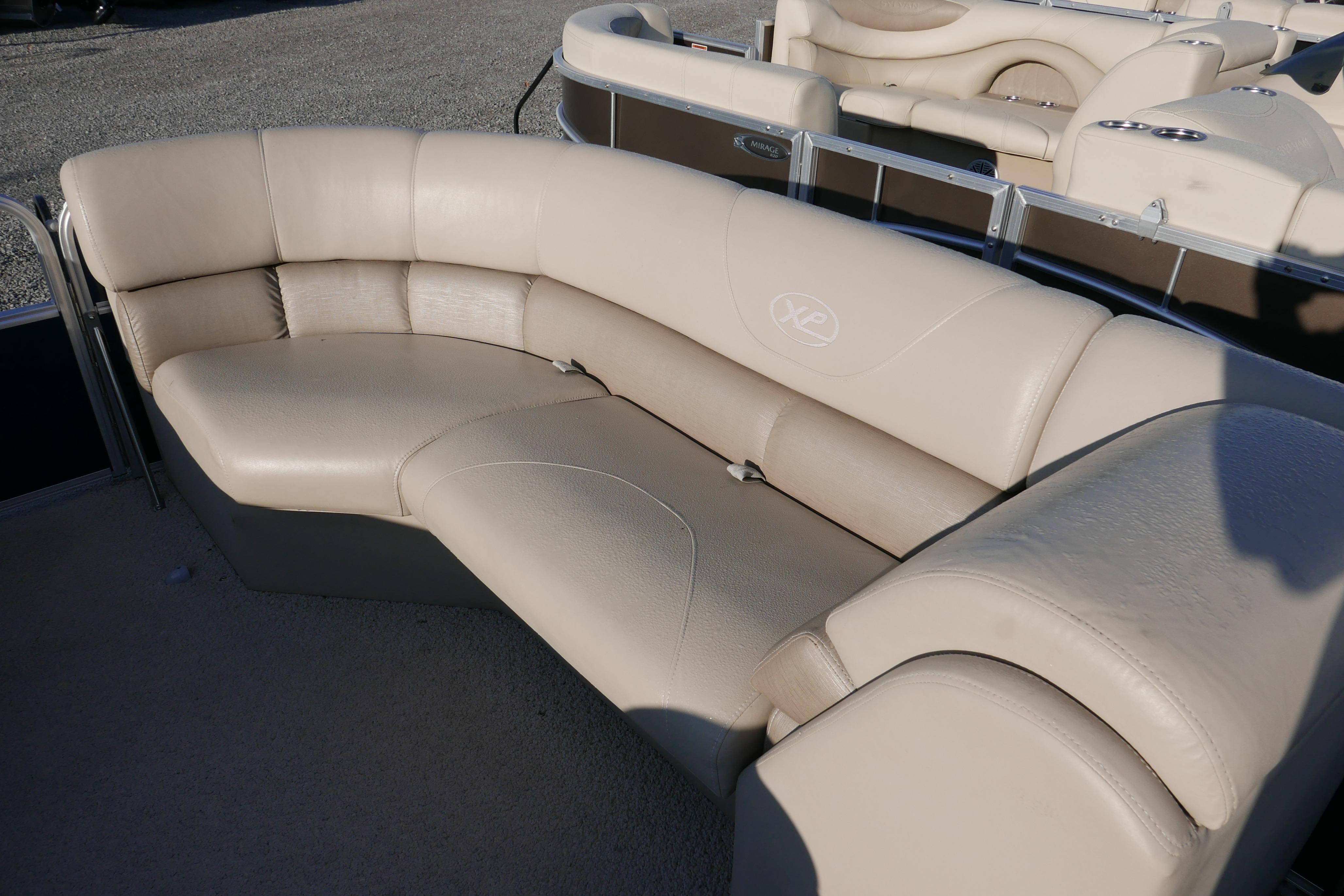 Beige leather seating on 2012 Xcusrion x2312 boat, featuring curved design.