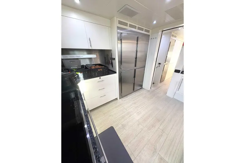 Namaste Yacht Photos Pics Modern kitchen interior on a 2013 Benetti Classic yacht, featuring sleek cabinetry and stainless steel appliances.