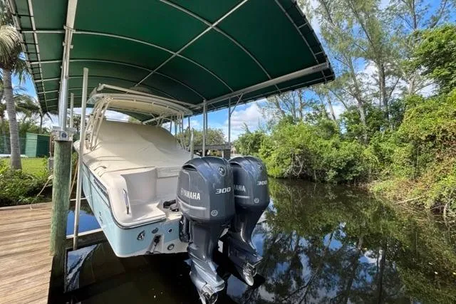  Yacht Photos Pics 2019 Grady-White Freedom 285 boat with twin Yamaha 300 engines under a canopy.