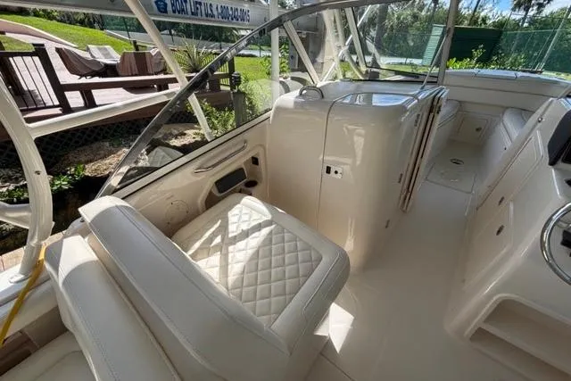  Yacht Photos Pics 2019 Grady-White Freedom 285 boat interior with luxurious seating and helm area.