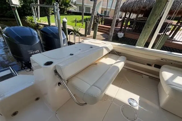  Yacht Photos Pics 2019 Grady-White Freedom 285 boat interior with seating and dual engines.