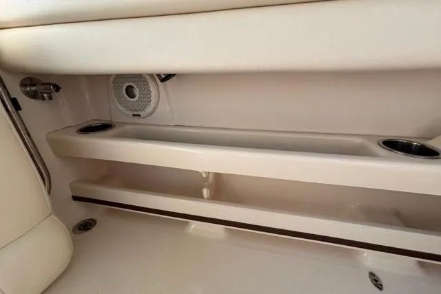  Yacht Photos Pics 2019 Grady-White Freedom 285 boat interior with cup holders and speaker.