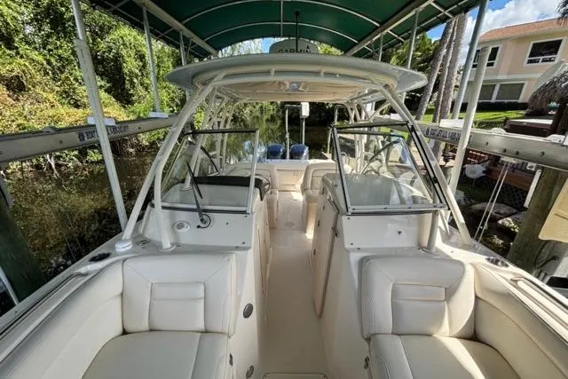  Yacht Photos Pics 2019 Grady-White Freedom 285 boat interior with seating and canopy.