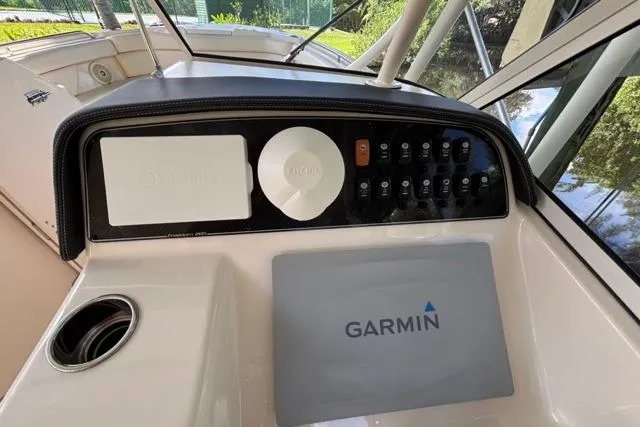  Yacht Photos Pics 2019 Grady-White Freedom 285 boat dashboard with Garmin navigation system and control panel.