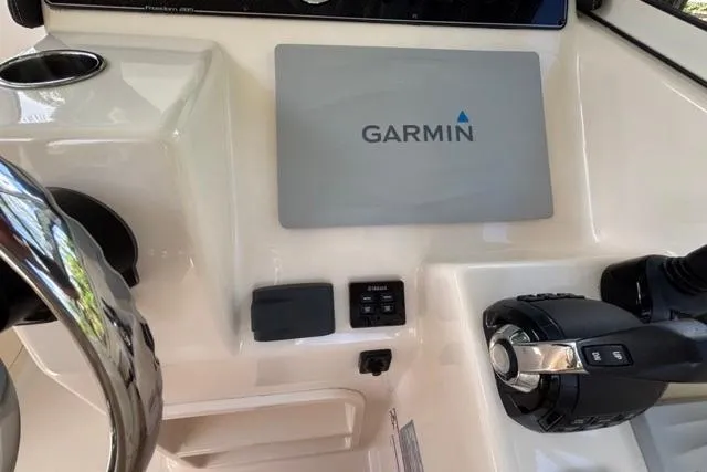  Yacht Photos Pics 2019 Grady-White Freedom 285 boat dashboard with Garmin navigation system and controls.