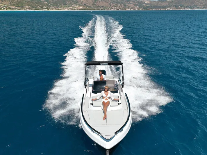  Yacht Photos Pics 2025 Ranieri NEXT 255 LX cruising on open blue sea, showcasing luxury and speed.