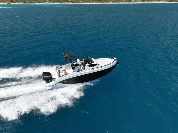  Yacht Photos Pics 2025 Ranieri NEXT 255 LX speedboat cruising on open blue water.