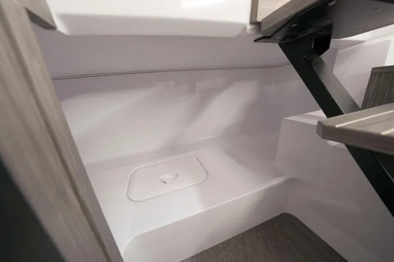  Yacht Photos Pics Interior view of 2025 Ranieri NEXT 255 LX boat, featuring sleek white surfaces and modern design.